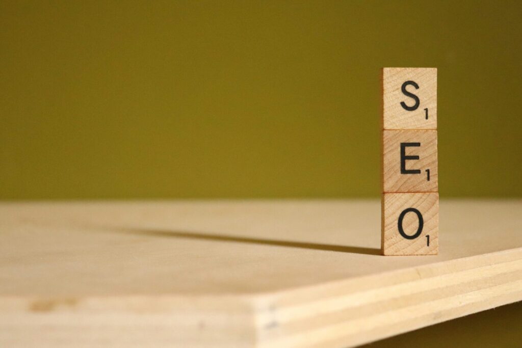 Symbol image with wooden blocks with the word SEO for blog AI for text creation