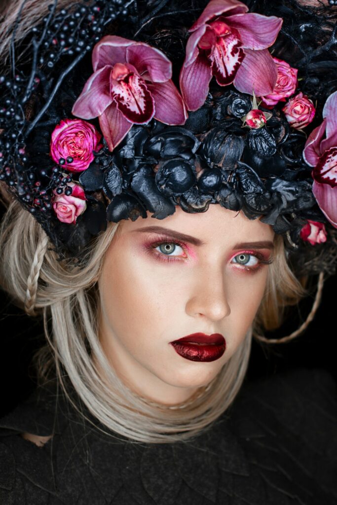 Made-up woman with headdress as symbolic image for blog article "The role of PIM in the beauty industry"