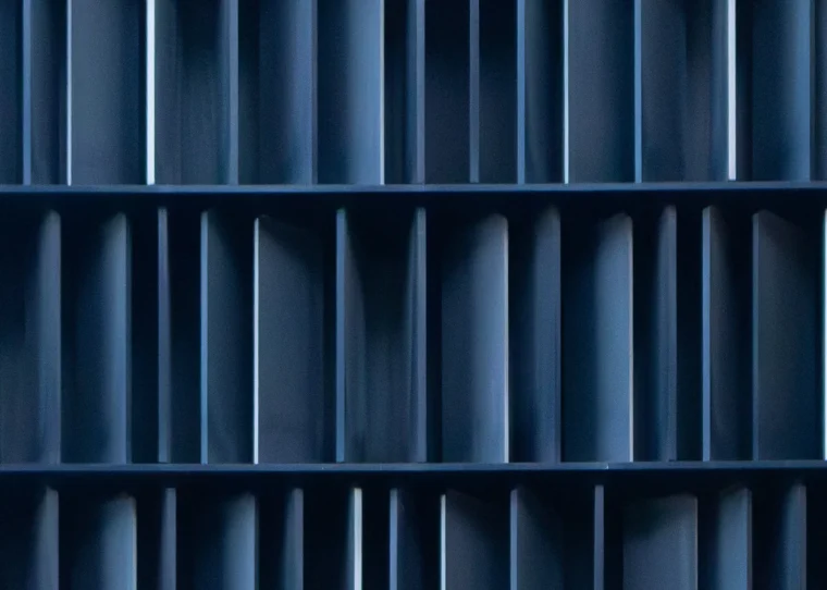 Abstract blue shelving grid symbolizing structured B2B ordering processes with Shopware B2B