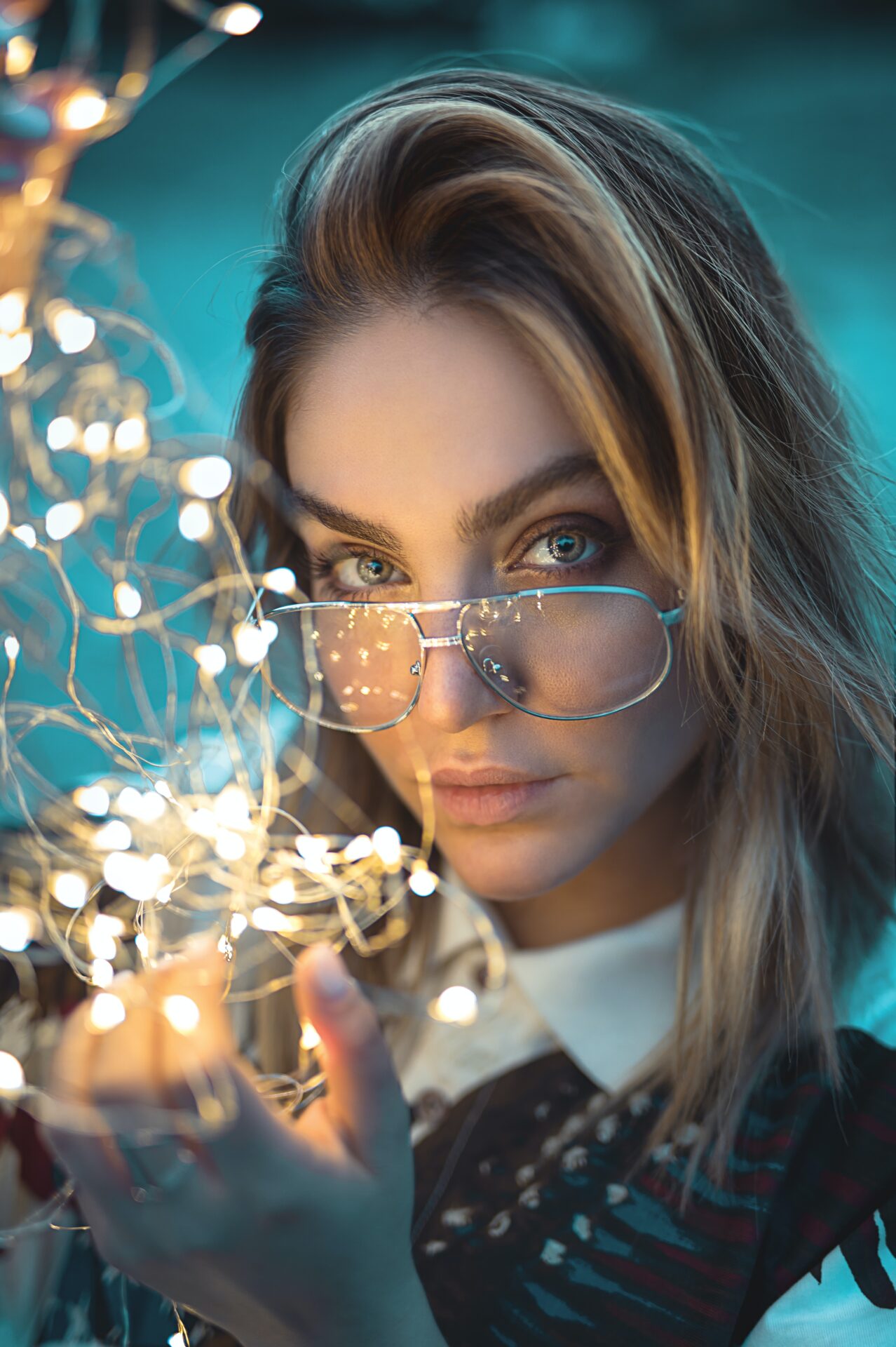 Woman with a string of fairy lights for the Whitepaper section