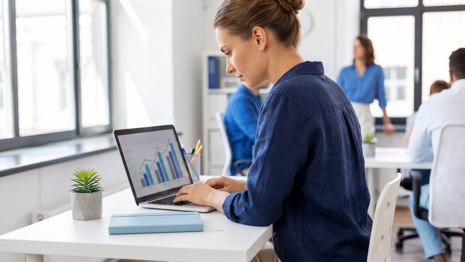 Content marketer analysing search performance on a laptop